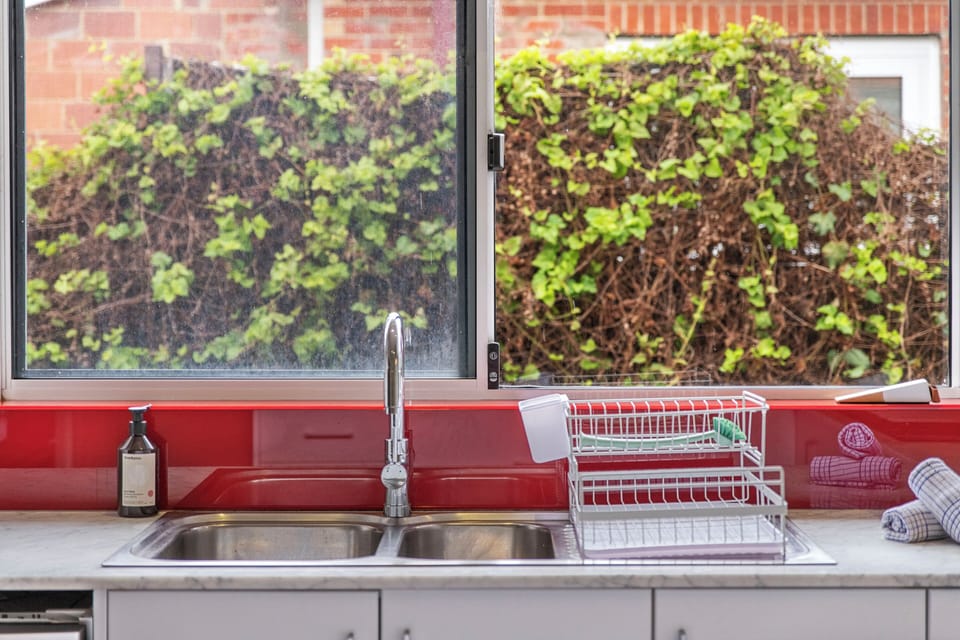 Bright and convenient! Enjoy preparing meals with a refreshing view of the greenery outside.