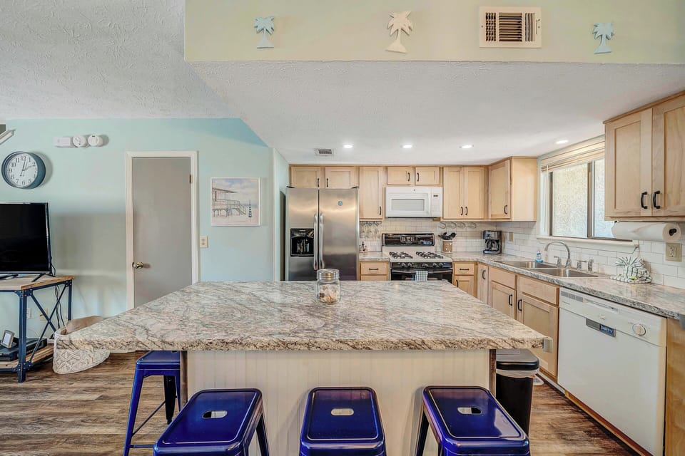 The fully equipped kitchen features granite countertops and a stainless-steel refrigerator and has everything you need to prepare meals for family & friends.