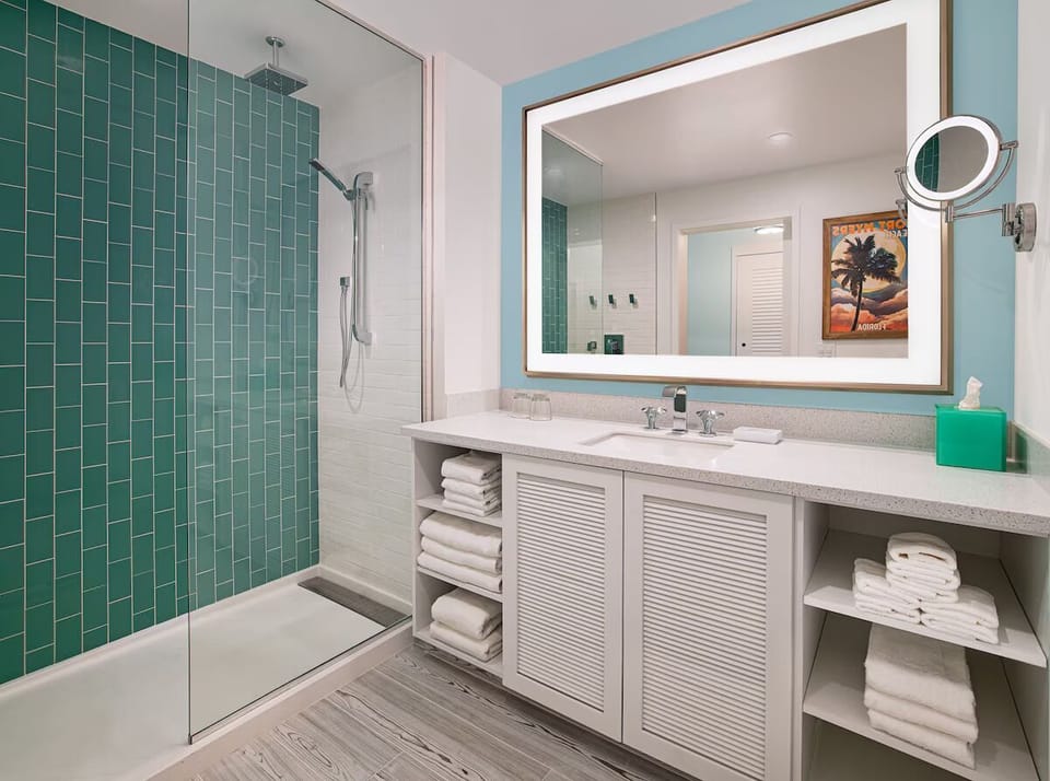 Refresh in a sleek, spa-bright bathroom with plush towels.