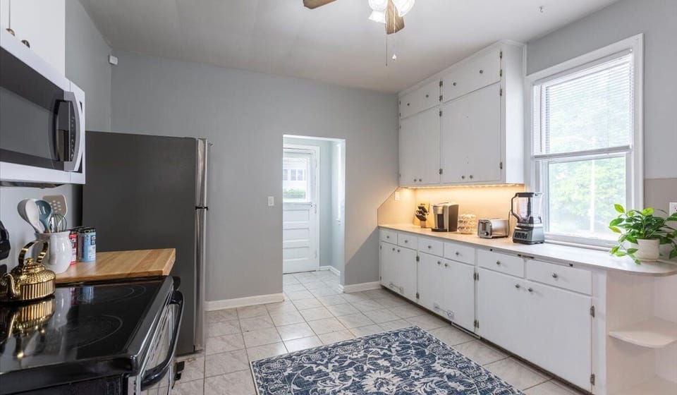 Dedicated coffee station with ample cupboards at the kitchen