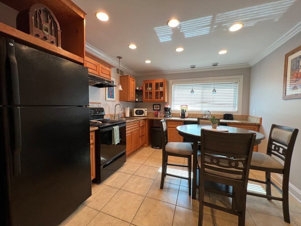 Spacious granite kitchen includes dishwasher, and all the kitchenware you need to prepare a nice meal