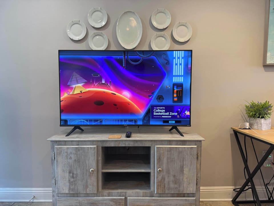 57" smart TV with Roku in the living room