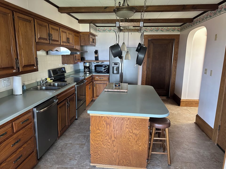 Fully stocked open kitchen with large island.  Cook or order in.