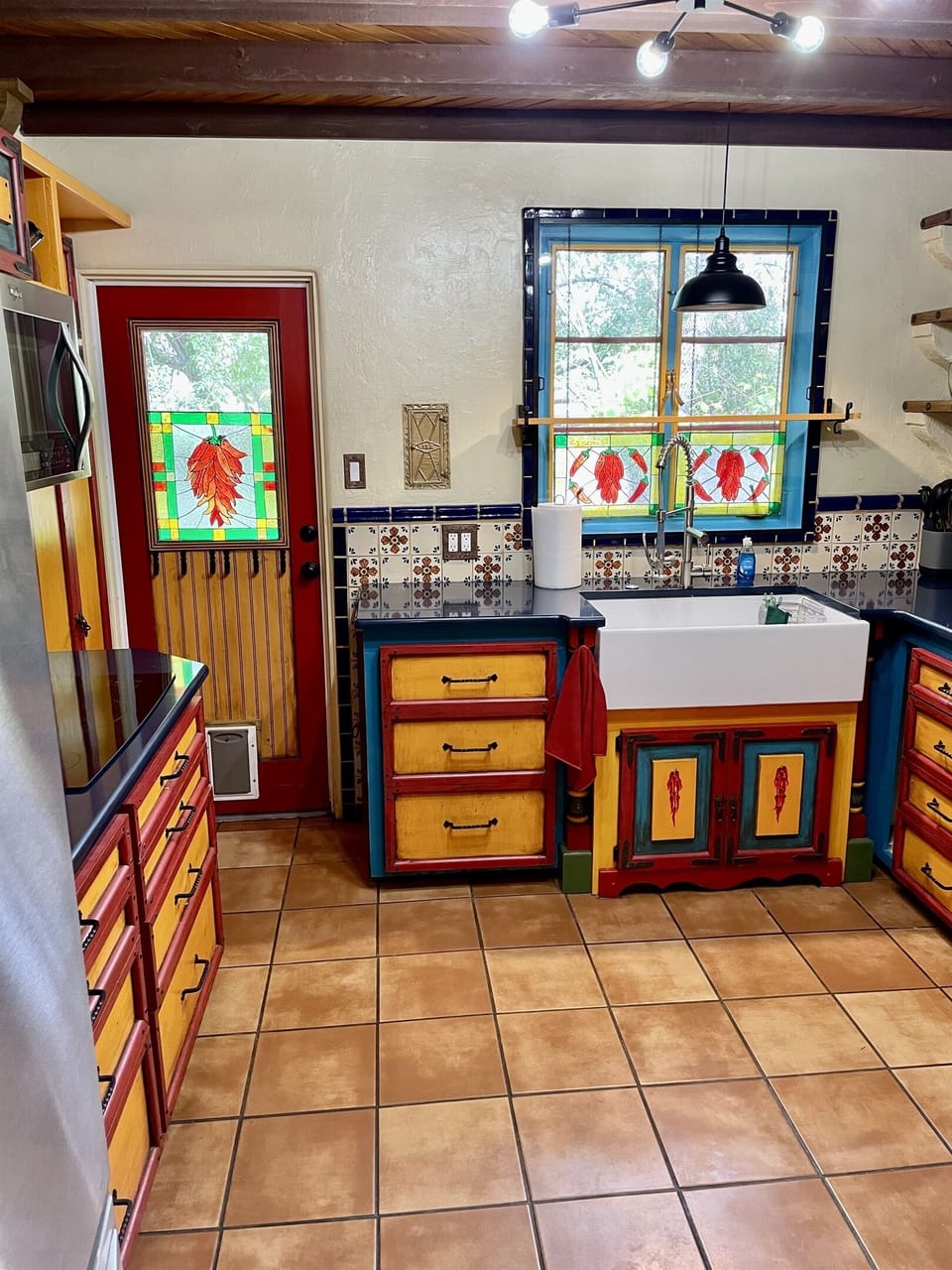 Hand-painted details and stained glass make this kitchen truly special.