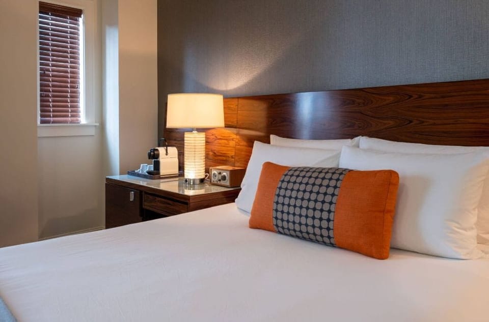 Chic and serene premium king room, outfitted with elegant furnishings and a soothing color palette for a relaxing stay.