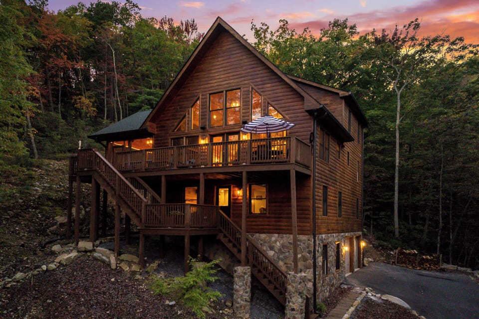 Escape to this stunning 8-bedroom log cabin in the heart of Massanutten! Perfect for families and groups, enjoy mountain views, a sauna, cozy wood burning fireplace, and wraparound deck. Just minutes from skiing, hiking, golf, and the water park.