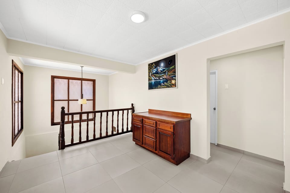 Stairs to the second floor of the home in Noord Aruba - Well-planned layout maximizing comfort and functionality for convenience - Stylish, contemporary furnishings enhancing the aesthetic