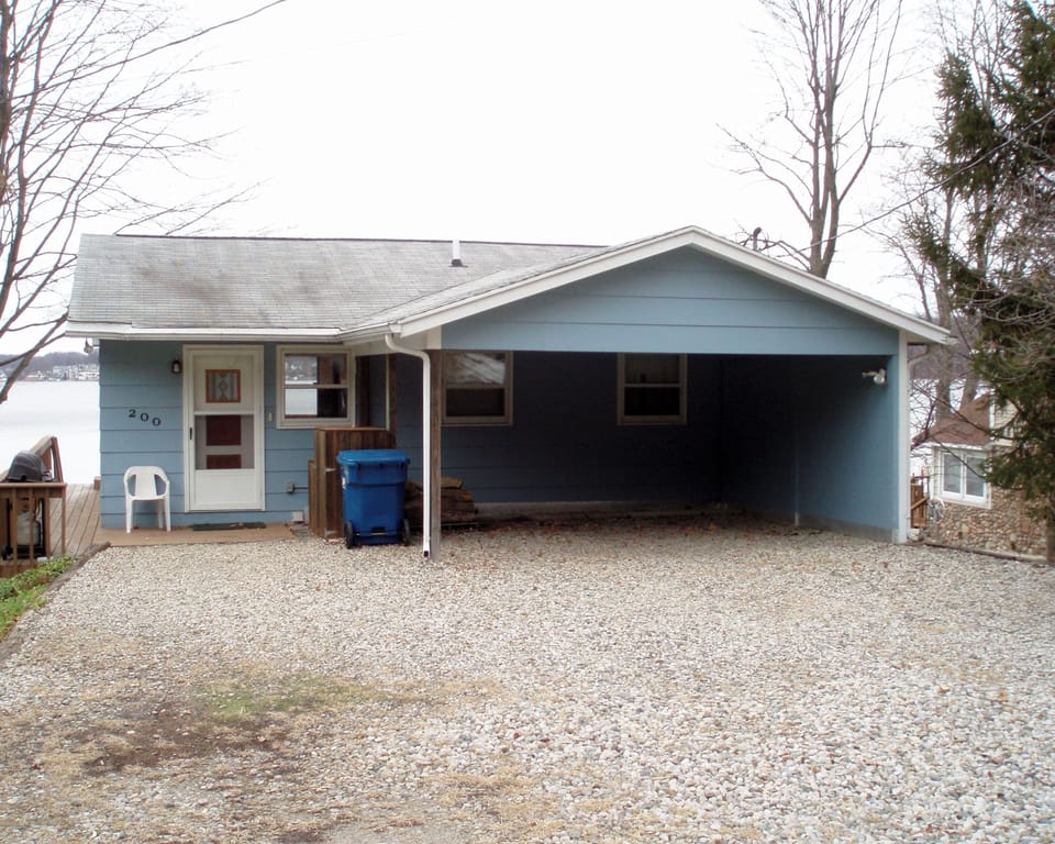 back of cottage with lots of parking