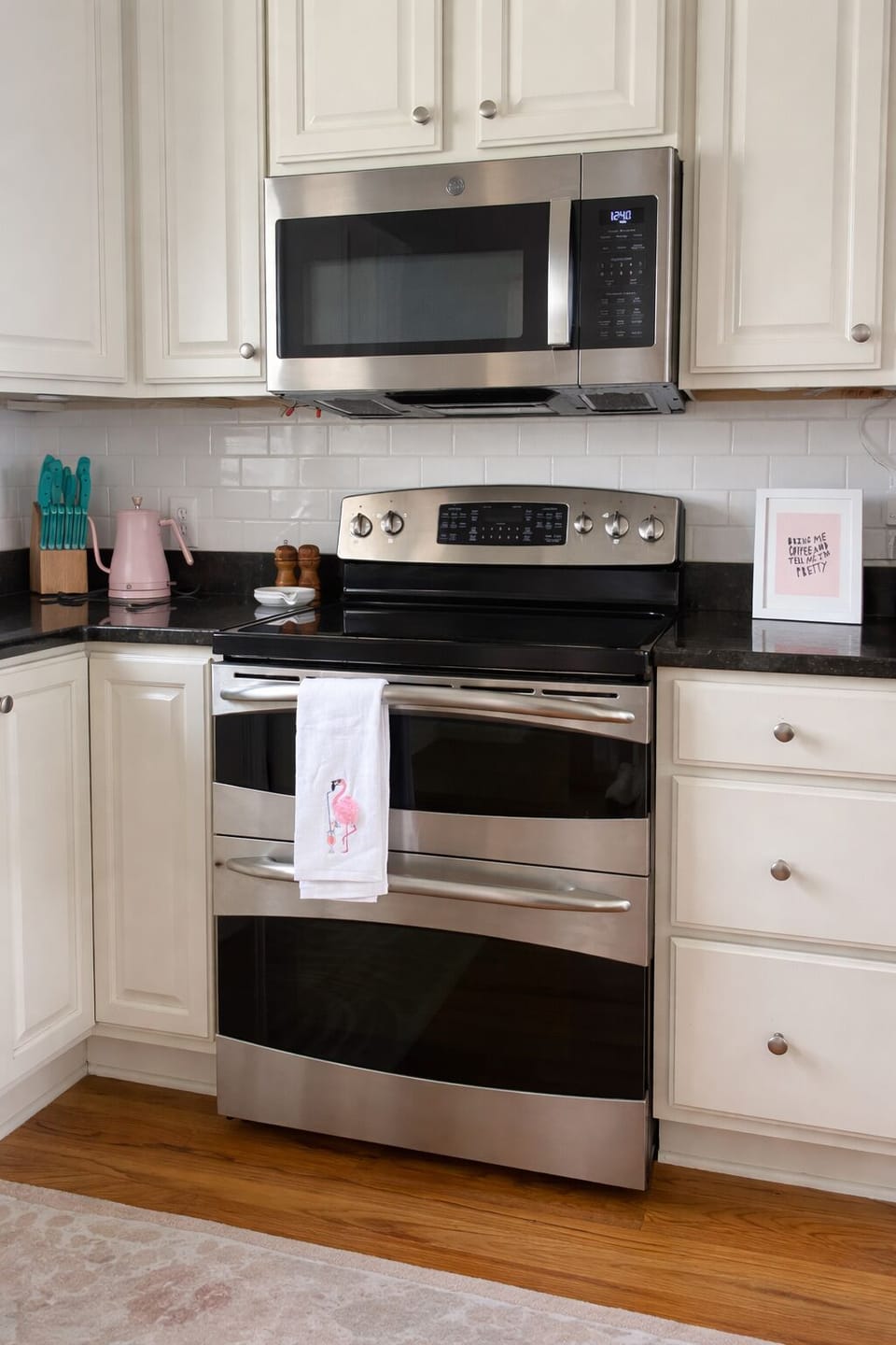 The fully stocked kitchen includes an oven/stove, microwave, fridge and freezer.
