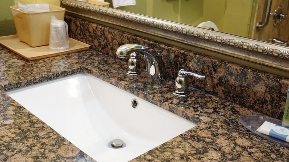 Freshen up easily with a spacious vanity and bright lighting.