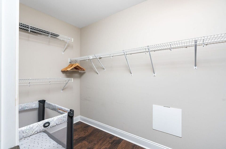 large walk in closet with pack n play