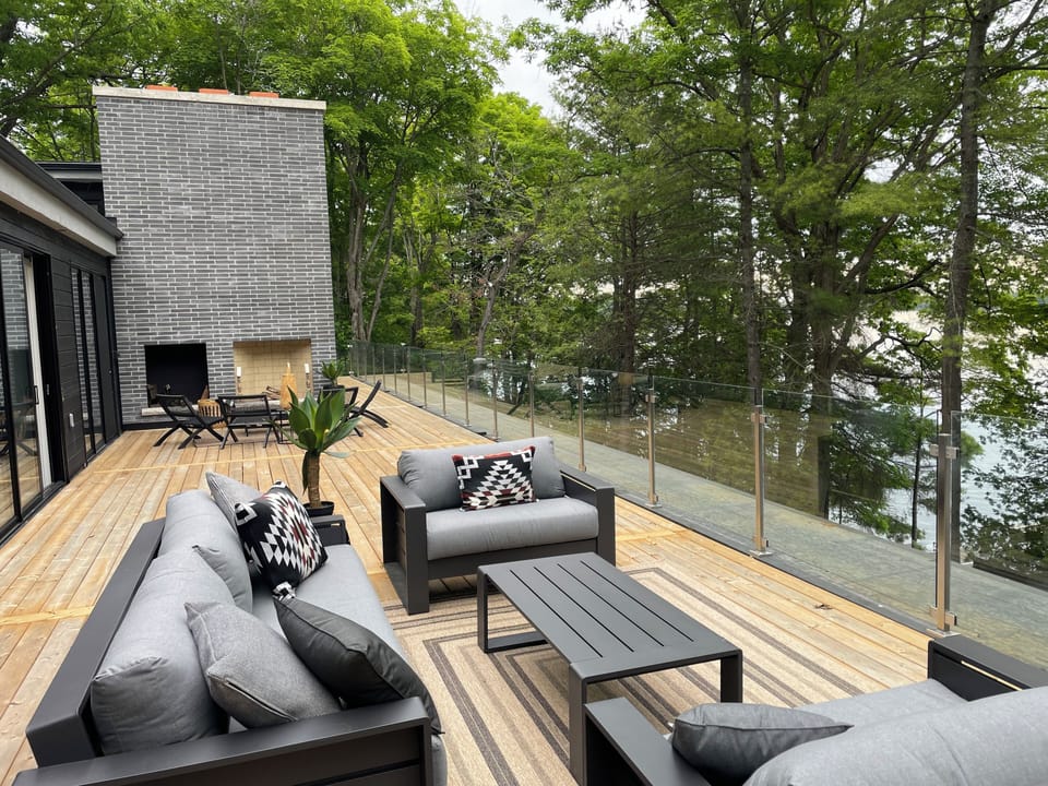 Huge upper deck with seating among the trees