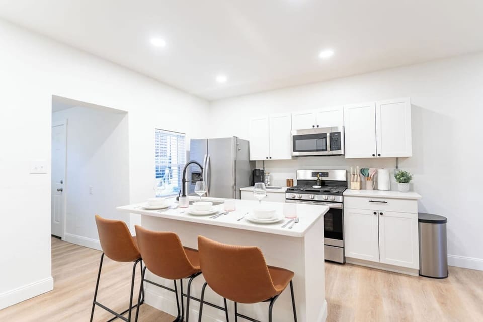 Chic kitchen dining countertop featuring a beautiful set of dishes, perfect for enjoying meals in style.