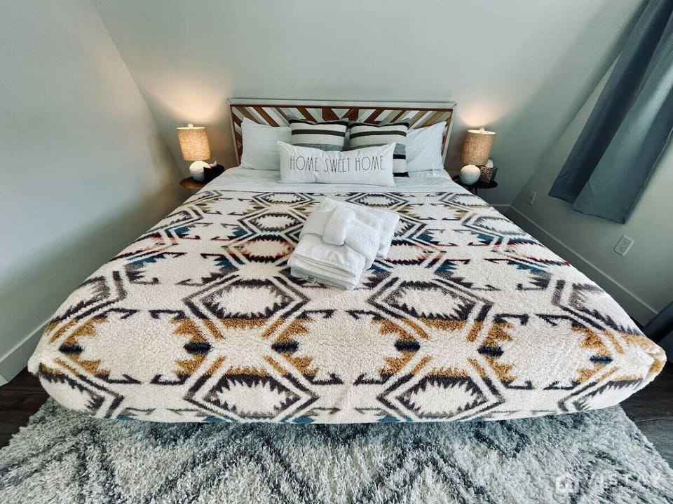 Enjoy a restful stay in Bedroom 1 with a relaxing queen-size bed, designed for ultimate comfort and relaxation.