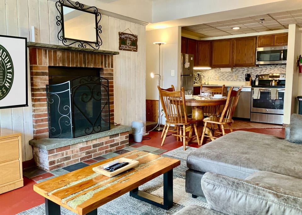Relax in the cozy living room with an electric fireplace.