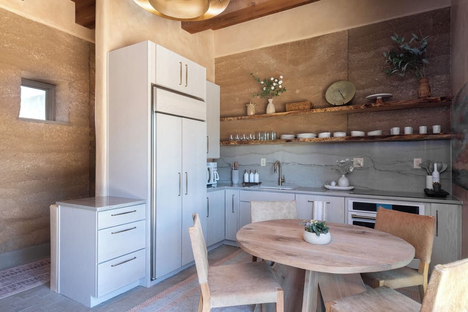 A full kitchen with seating for four.