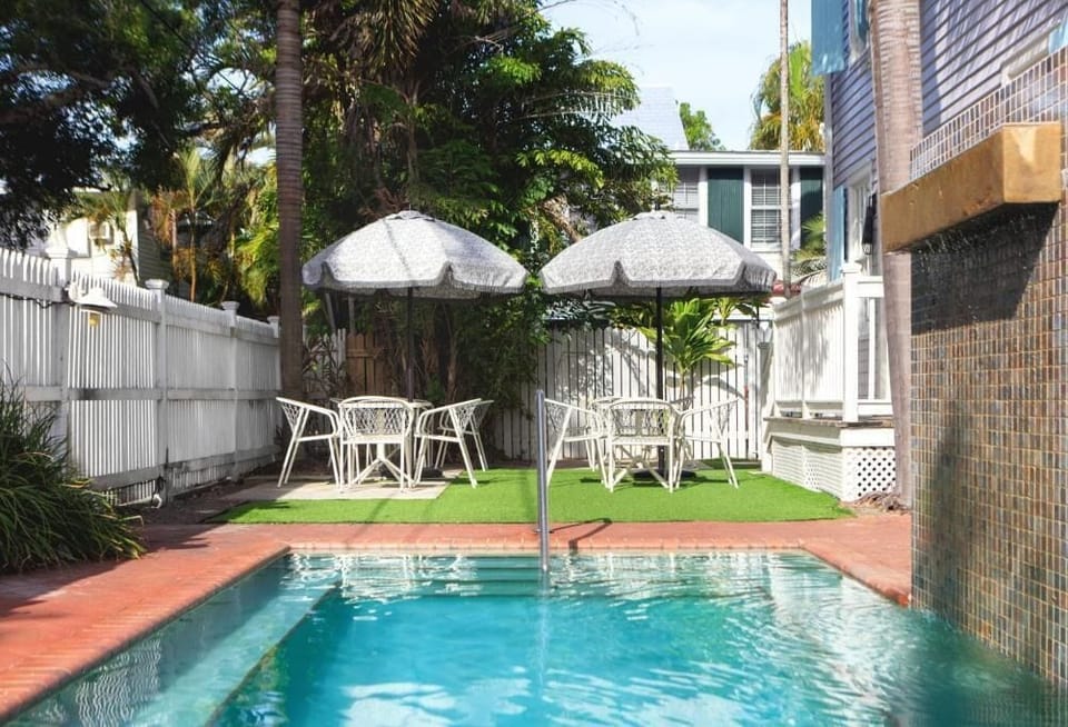 Cool off in the sparkling pool with shaded tables nearby.