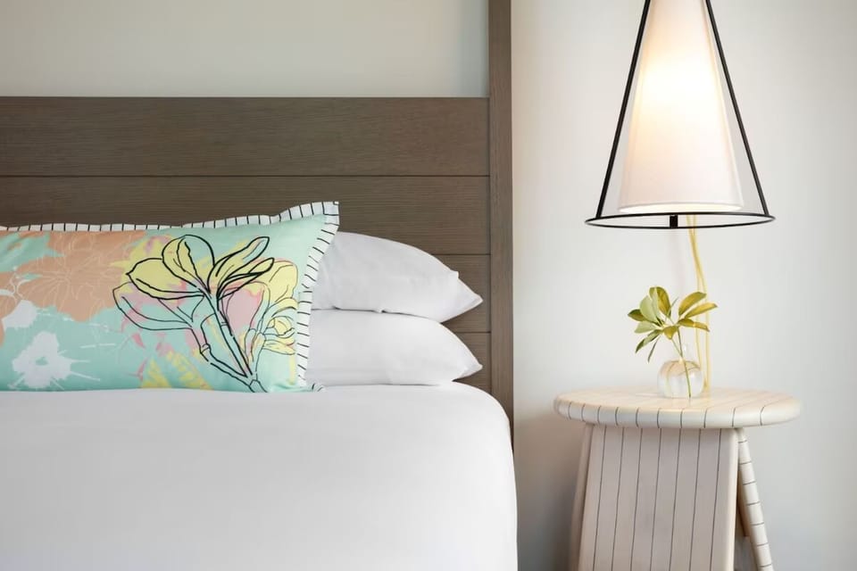 Recharge beside soft pillows and calming, minimalist decor details.