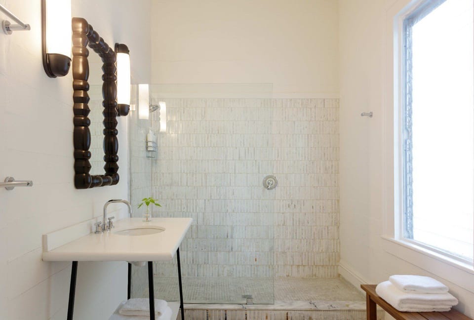 Refresh in a sunlit, spa-like bath with walk-in shower.