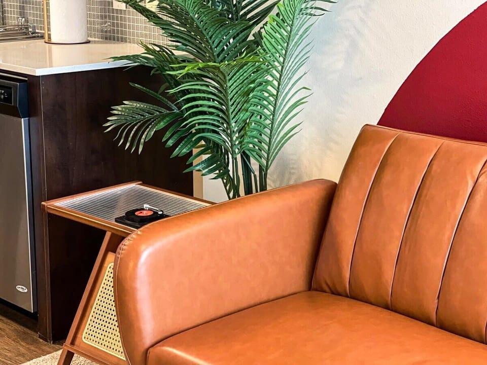 Sophisticated furniture

Modern Boho Style Apartment 

Living room with a sofa, and a 65" Smart TV with (Netflix, Hulu, Disney+) included for free.