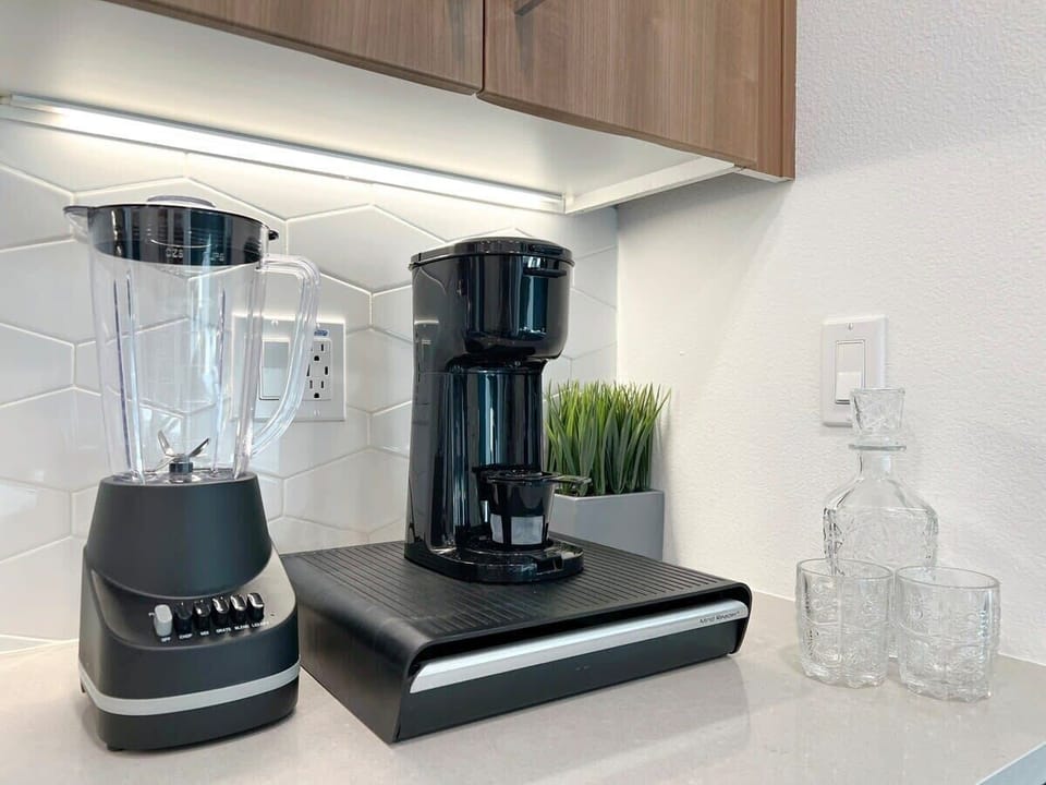 Indulge in luxury with included amenities like a coffee machine, fine glassware, a liquor pitcher, and complimentary coffee.