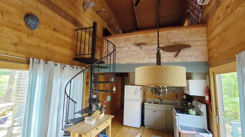 Dining area with kitchen beyond