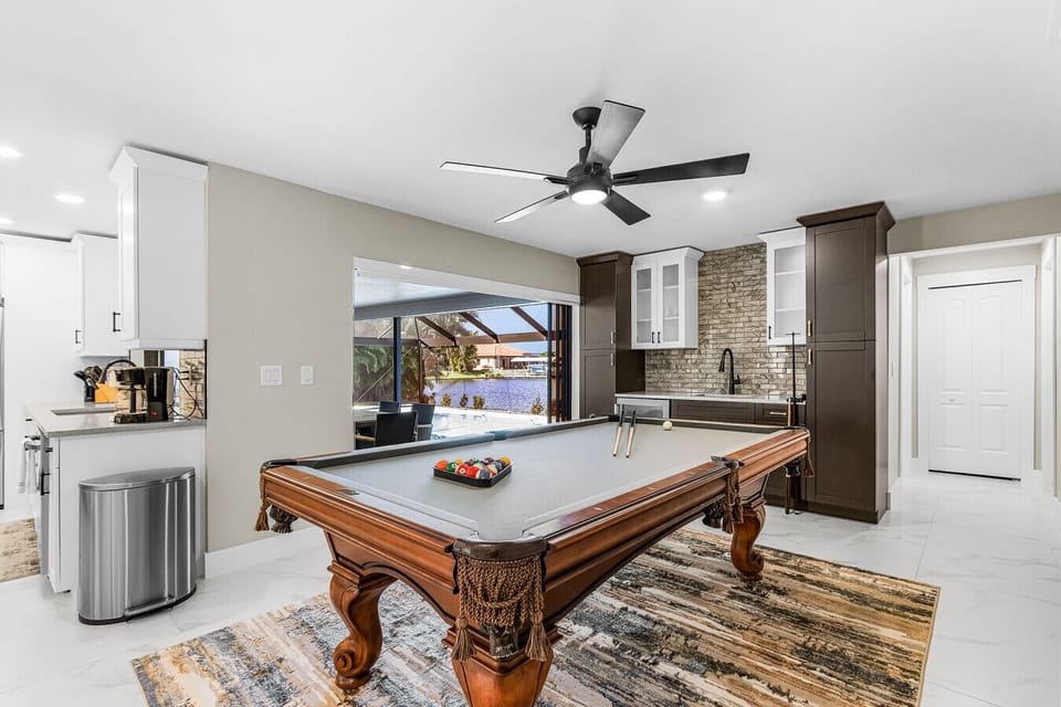 Spacious indoor entertainment area featuring a full-size billiard table—perfect for rainy days or evening fun with the family.