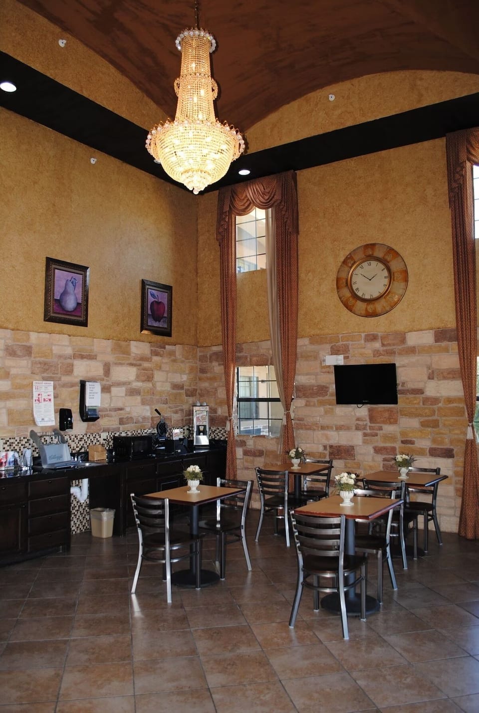 Start mornings beneath sparkling chandeliers in a cozy breakfast room.