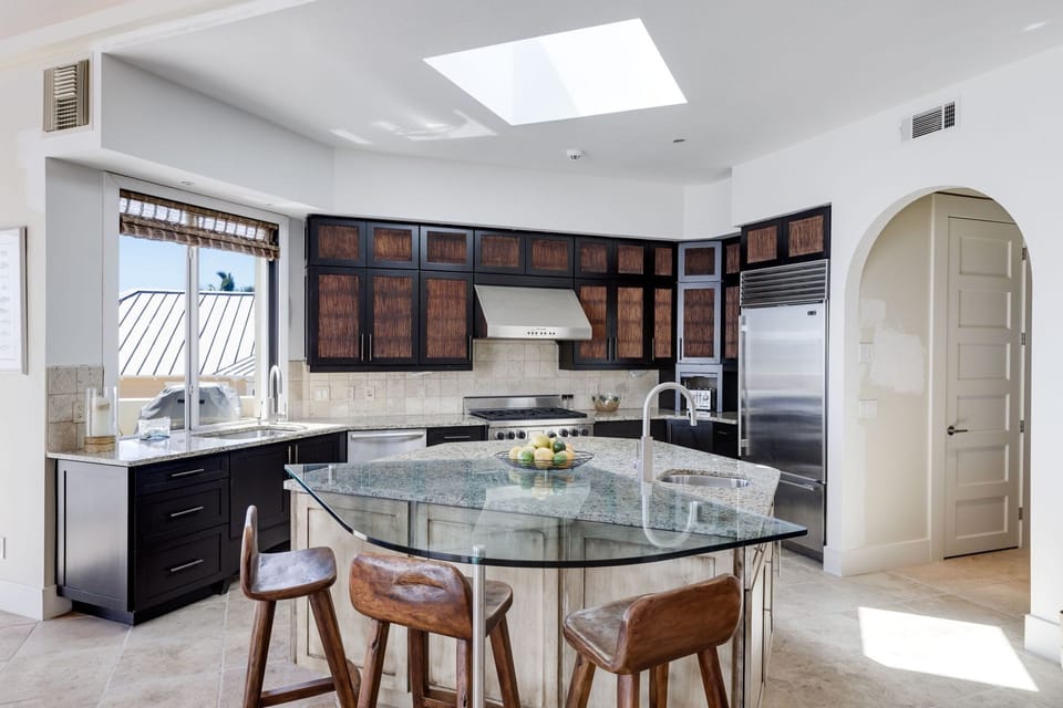 Chef's Kitchen featuring breakfast bar with seating for 3 guests and ample cooking space