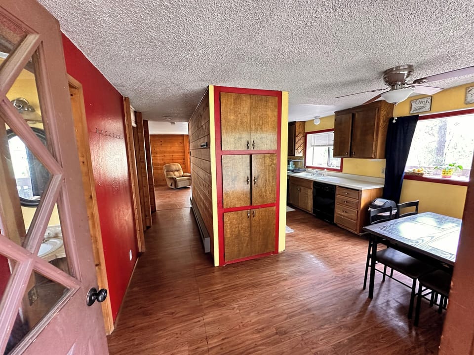 Side door entrance, half bath to the left, living room straight through the hall