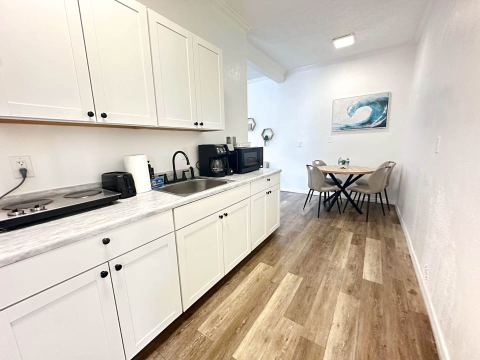 Fully equipped kitchen with all the essentials for cooking and dining.