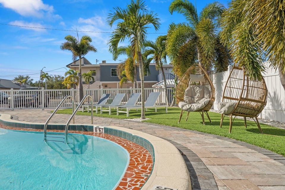Relaxing pool area with lounge chairs to enjoy the sun.