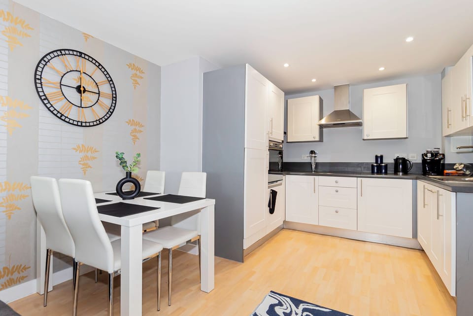 "Cozy dining area and kitchen, each offering a comfortable space for enjoying meals and preparing your favorite dishes.