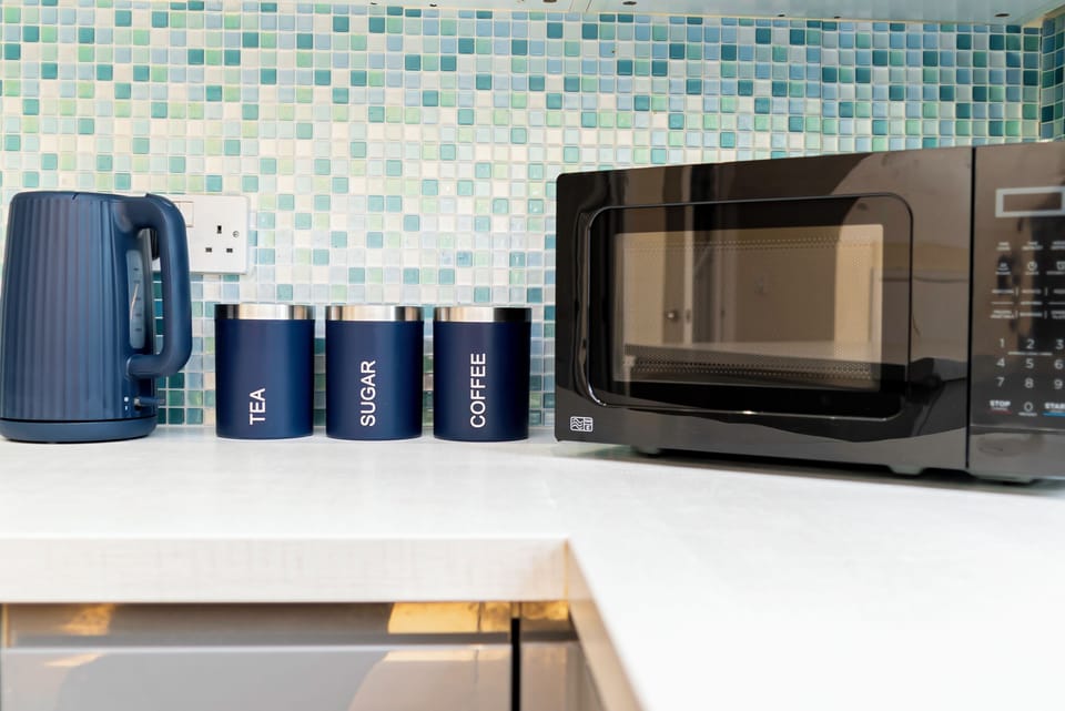 Kitchen Amenities
Relax with our coffee and tea station, complete with a microwave for easy heating, making it perfect for your morning routine.