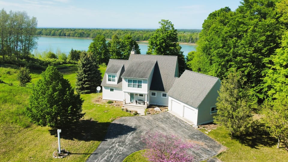OVERALL:  Aerial photo of the home with pristine Long Lake in the background.