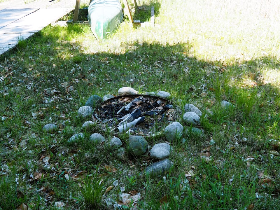 EXTERIOR:  The lakeside firepit that is available for guests to use.