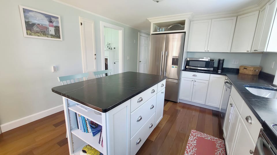 Nicely equipped kitchen with stainless appliances and center island