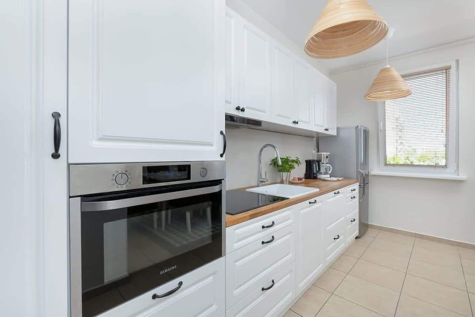 The kitchen offers a functional layout for convenient cooking. 