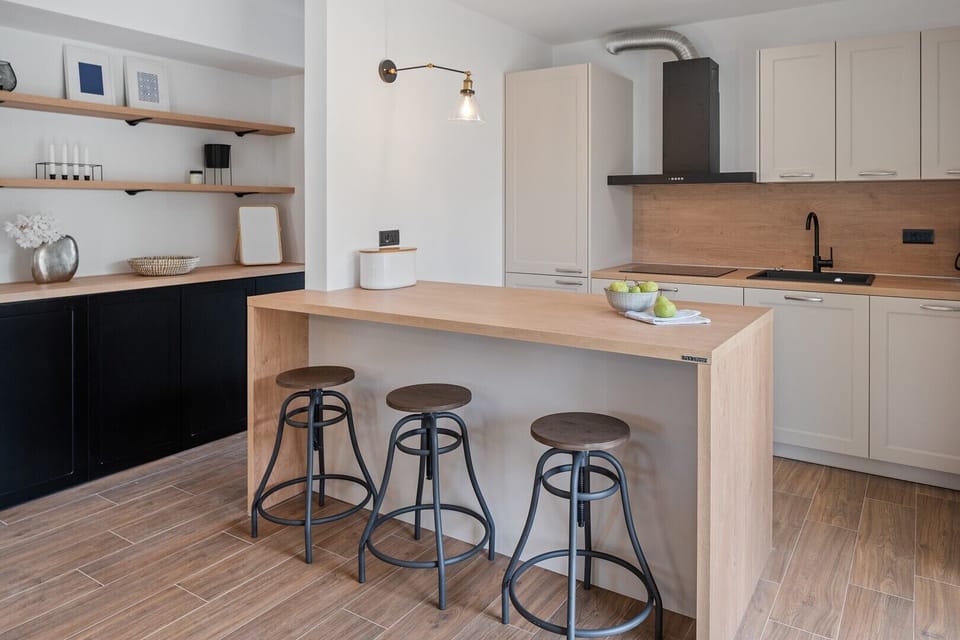 The kitchen island has all the amenities a modern guest needs