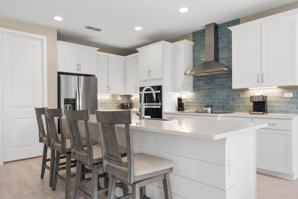 Kitchen with four swivel barstools