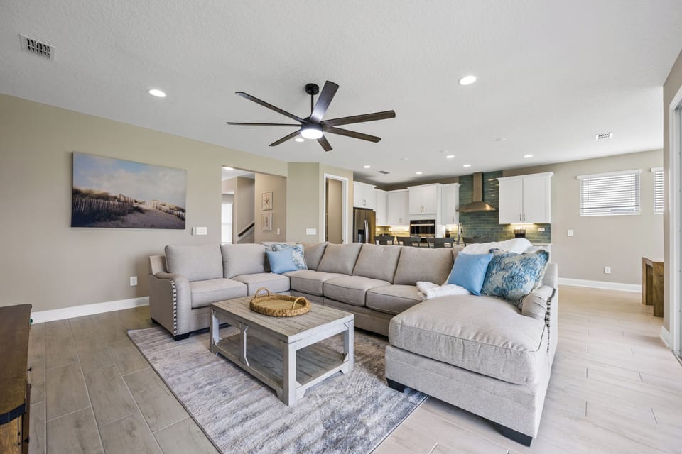 Living room with overstuffed couch and 75" LED TV