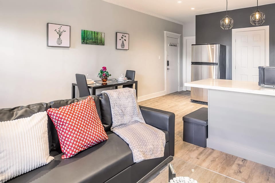 Bright And Airy Space With Stylish Furniture And Kitchen Access