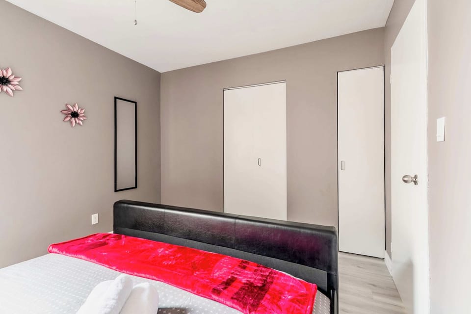 Spacious Bedroom With A King Bed And Vibrant Decor