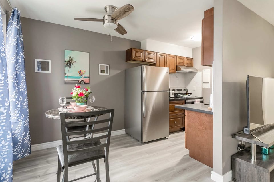 Cozy Dining Area Next To A Fully Equipped Kitchen