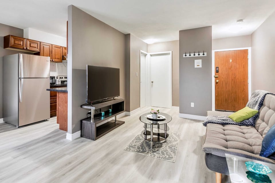 Open Concept Space Featuring Smart TV And A Comfortable Sofa Bed