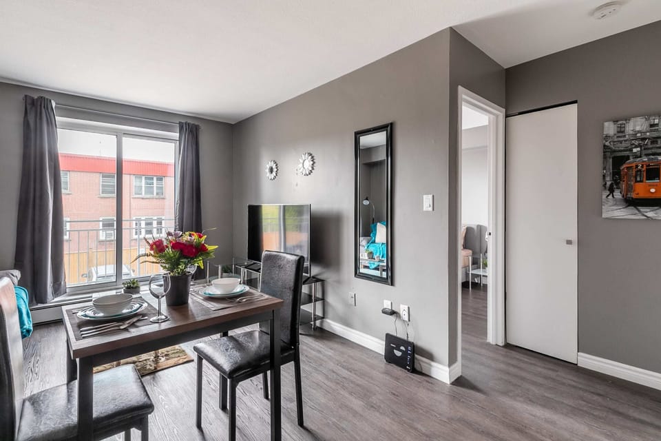 Cozy Dining Area With Balcony Views And Natural Light