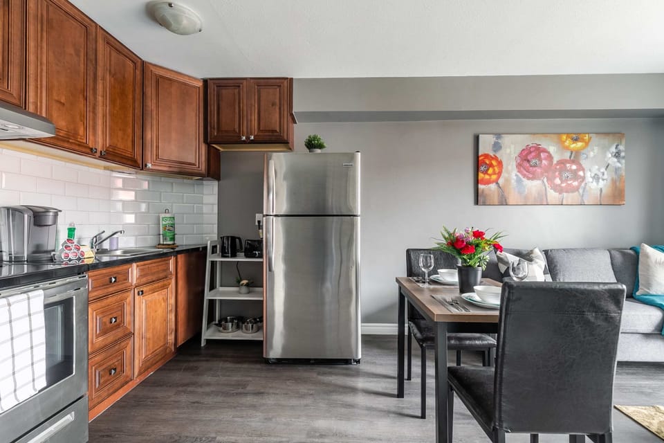 Stylish Kitchen And Dining Setup With Elegant Finishes
