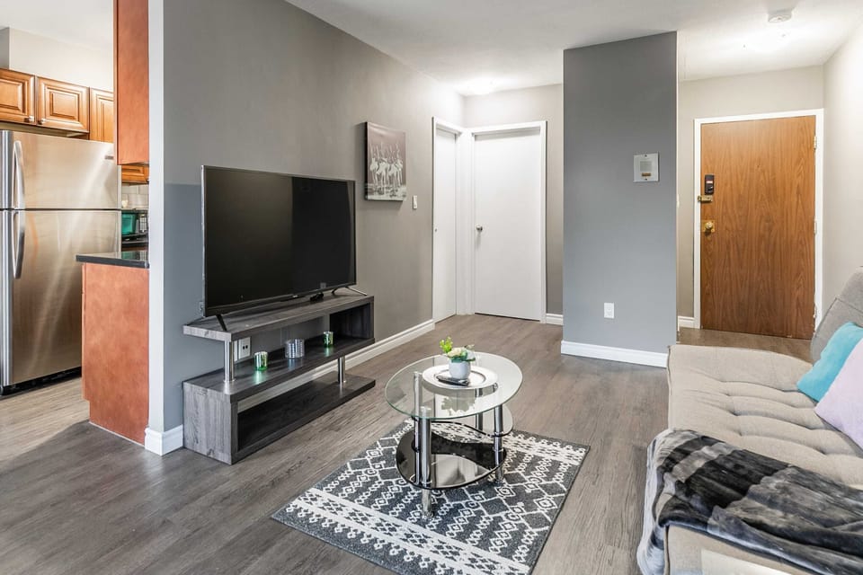 Modern Living Area With Smart TV And Sofa Bed