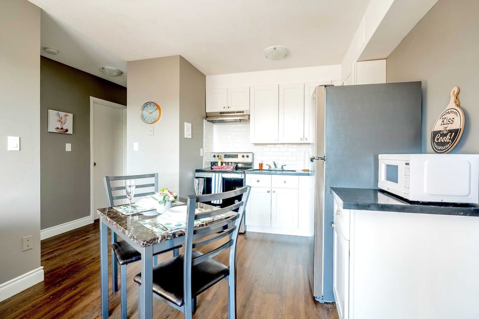 Dining Table For Four Next To A Fully Equipped Kitchen