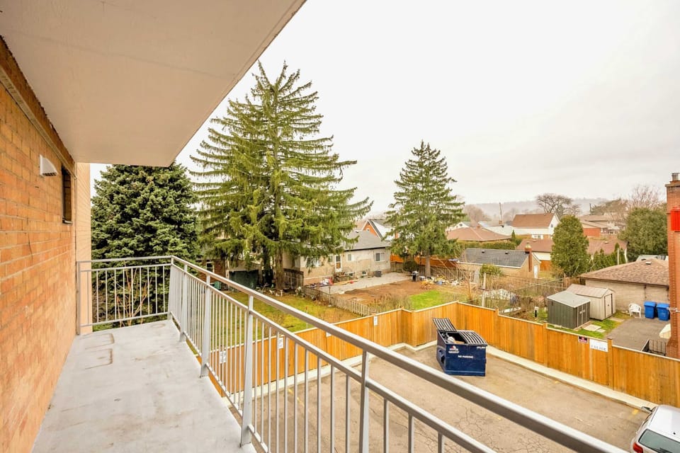 Spacious Balcony With A View Of The Neighborhood And Ample Space To Relax